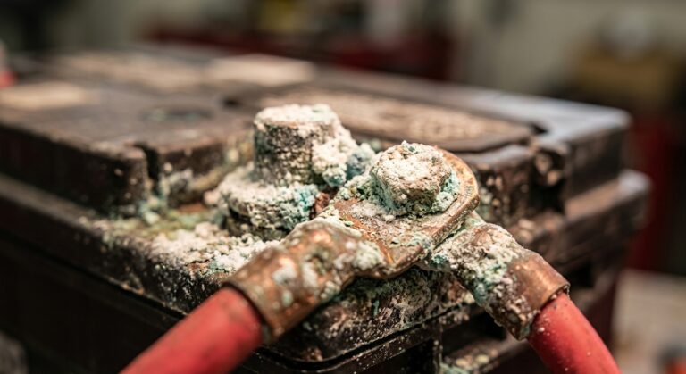 Corroded battery terminal with white and green deposits